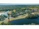 Aerial view of community near golf course and lake at 749 Midway Dr # A, Ocala, FL 34472