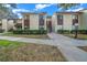 Well-maintained condo building with landscaping and walkway at 749 Midway Dr # A, Ocala, FL 34472