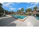 Community pool with lounge chairs at 749 Midway Dr # A, Ocala, FL 34472