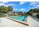 Community swimming pool with surrounding patio furniture at 749 Midway Dr # A, Ocala, FL 34472