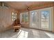 Sunroom with wood ceiling, tiled floor and relaxing chair at 749 Midway Dr # A, Ocala, FL 34472