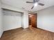 Bedroom with wood flooring, ceiling fan and closet at 7567 Sw 108Th Pl, Ocala, FL 34476