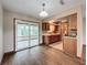 Kitchen and dining area with sunroom access at 7567 Sw 108Th Pl, Ocala, FL 34476