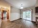 Dining area with sliding doors to a sunroom at 7567 Sw 108Th Pl, Ocala, FL 34476