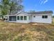 House exterior showcasing screened porch and backyard at 7567 Sw 108Th Pl, Ocala, FL 34476