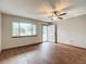 Living room with large window and wood-look floors at 7567 Sw 108Th Pl, Ocala, FL 34476