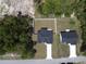 Aerial view of new construction home with fenced backyard and driveway at 7747 Sw 146Th Lane Rd, Ocala, FL 34473