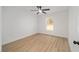 Bright bedroom with window, ceiling fan, and wood-look floors at 7747 Sw 146Th Lane Rd, Ocala, FL 34473