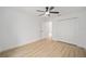 Well-lit bedroom with double door closet and ceiling fan at 7747 Sw 146Th Lane Rd, Ocala, FL 34473