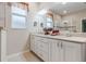 Elegant bathroom with double vanity and large mirror at 7838 Sw 85Th Cir, Ocala, FL 34481