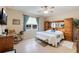 Large main bedroom with ceiling fan and en-suite bathroom at 7838 Sw 85Th Cir, Ocala, FL 34481