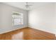 Well-lit bedroom with wood floors and window at 8217 Sw 61St Ct, Ocala, FL 34476