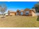 House exterior with landscaping and stone accents at 8217 Sw 61St Ct, Ocala, FL 34476