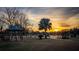 Equestrian arena featuring a sunset, trees and a gazebo at 8250 Nw 136Th Avenue Rd, Ocala, FL 34482