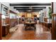 Rustic dining area with wood floors and exposed beams at 8250 Nw 136Th Avenue Rd, Ocala, FL 34482