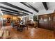 Rustic dining area with wood floors and exposed beams at 8250 Nw 136Th Avenue Rd, Ocala, FL 34482