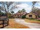 Elegant home with arched entryway and driveway at 8250 Nw 136Th Avenue Rd, Ocala, FL 34482