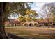 Impressive estate home with red tile roof, arched entryways and lush grounds at 8250 Nw 136Th Avenue Rd, Ocala, FL 34482