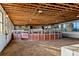 Indoor riding arena with brick walls and ample space for riding at 8250 Nw 136Th Avenue Rd, Ocala, FL 34482