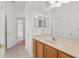 Bathroom featuring a vanity with a large mirror, ample lighting, and tile flooring at 8535 Sw 82Nd Ter, Ocala, FL 34481