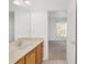 Bathroom featuring a vanity with marble countertop, a large mirror, and view into the bedroom at 8535 Sw 82Nd Ter, Ocala, FL 34481