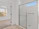 Bright bathroom features glass shower door and view to the bedroom at 8535 Sw 82Nd Ter, Ocala, FL 34481