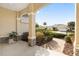 Inviting front porch with stone accents, columns, pavers and lush landscaping at 8535 Sw 82Nd Ter, Ocala, FL 34481