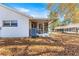 Home's exterior showcases a screened porch and AC unit at 8890 Sw 96Th St # D, Ocala, FL 34481