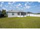 Large backyard with grassy lawn at 891 Nw 44Th Street Rd, Ocala, FL 34475