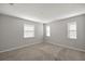 Simple bedroom with neutral walls and carpeted floor at 891 Nw 44Th Street Rd, Ocala, FL 34475