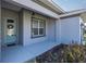 Front porch with a light fixture and decorative plants at 891 Nw 44Th Street Rd, Ocala, FL 34475