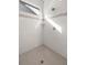 Large walk-in shower with neutral tile and window at 891 Nw 44Th Street Rd, Ocala, FL 34475