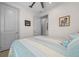 Spacious bedroom with tiled floors, a ceiling fan, and gray doors at 8958 Sw 57Th Place Rd, Ocala, FL 34481