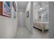 Hallway leading to a bedroom with a ceiling fan and tiled flooring at 8958 Sw 57Th Place Rd, Ocala, FL 34481