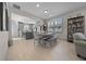 Dining room with a wooden table and bench, kitchen view, and hardwood floors at 8958 Sw 57Th Place Rd, Ocala, FL 34481