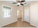 Bedroom with ceiling fan, window, and access to another room at 9119 Sw 70Th Loop, Ocala, FL 34481