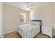 Bedroom with floral bedding and ceiling fan at 9119 Sw 70Th Loop, Ocala, FL 34481