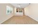 Dining area with wood floors, neutral walls, and kitchen access at 9119 Sw 70Th Loop, Ocala, FL 34481