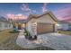 One-story home with brown garage door, stone accents, and landscaped walkway at 9119 Sw 70Th Loop, Ocala, FL 34481