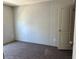 Clean, bright bedroom with neutral walls, soft carpet, and closet for ample storage at 9160 Sw 31St Avenue Rd, Ocala, FL 34476