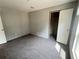 Bedroom featuring soft carpet, neutral walls, and closet for storage at 9160 Sw 31St Avenue Rd, Ocala, FL 34476
