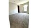 Bedroom showcasing a window and closet with light grey walls and soft carpet at 9160 Sw 31St Avenue Rd, Ocala, FL 34476
