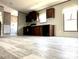 Inviting kitchen featuring wood cabinetry, stainless sink, and lots of natural light at 9160 Sw 31St Avenue Rd, Ocala, FL 34476