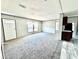 Comfortable living room featuring plush carpeting, neutral walls, and lots of natural light at 9160 Sw 31St Avenue Rd, Ocala, FL 34476