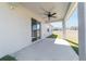 Covered patio with sliding glass door access and ceiling fan at 9780 Sw 42Nd Ave, Ocala, FL 34476