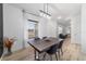 Modern dining room with dark wood table and open concept at 9780 Sw 42Nd Ave, Ocala, FL 34476