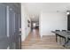 Bright entryway with light wood floors, leading to living room at 9780 Sw 42Nd Ave, Ocala, FL 34476