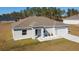 Single-story house with a gray roof and white exterior at 9780 Sw 42Nd Ave, Ocala, FL 34476