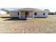 Rear view of house with covered patio and yard at 9780 Sw 42Nd Ave, Ocala, FL 34476