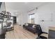 Bright living room with hardwood floors, sofa, and built-in shelving at 9780 Sw 42Nd Ave, Ocala, FL 34476